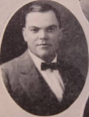 a person in a suit and bow tie