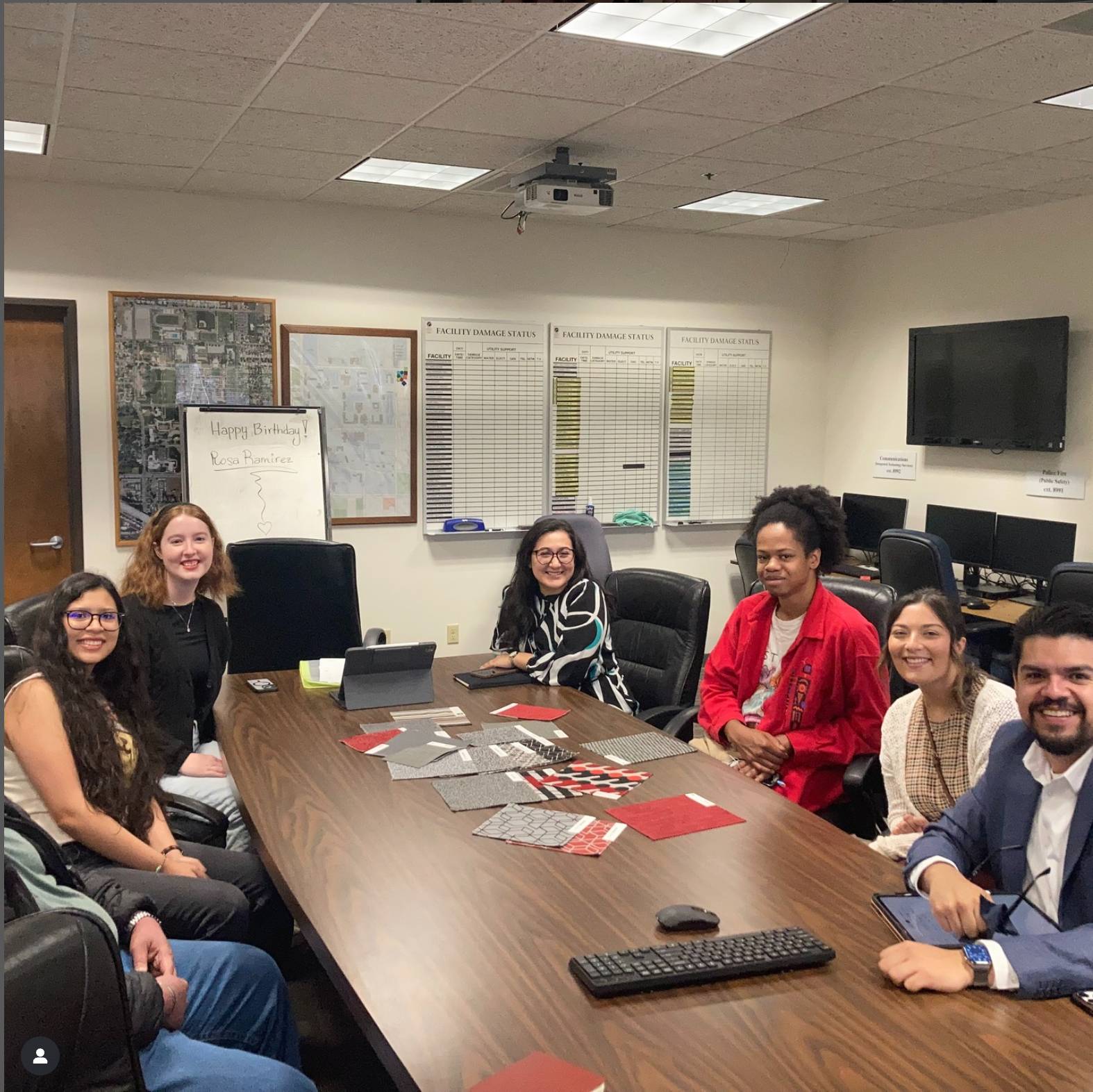 a group of people sitting around a table
