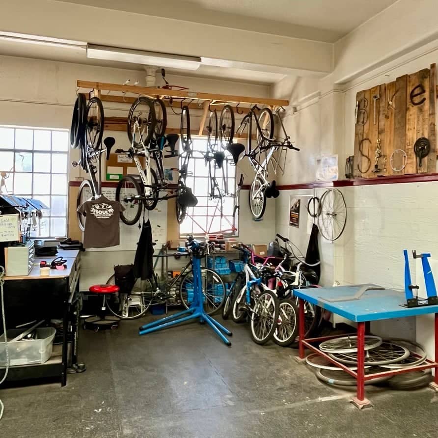 a room with persony bicycles from the ceiling