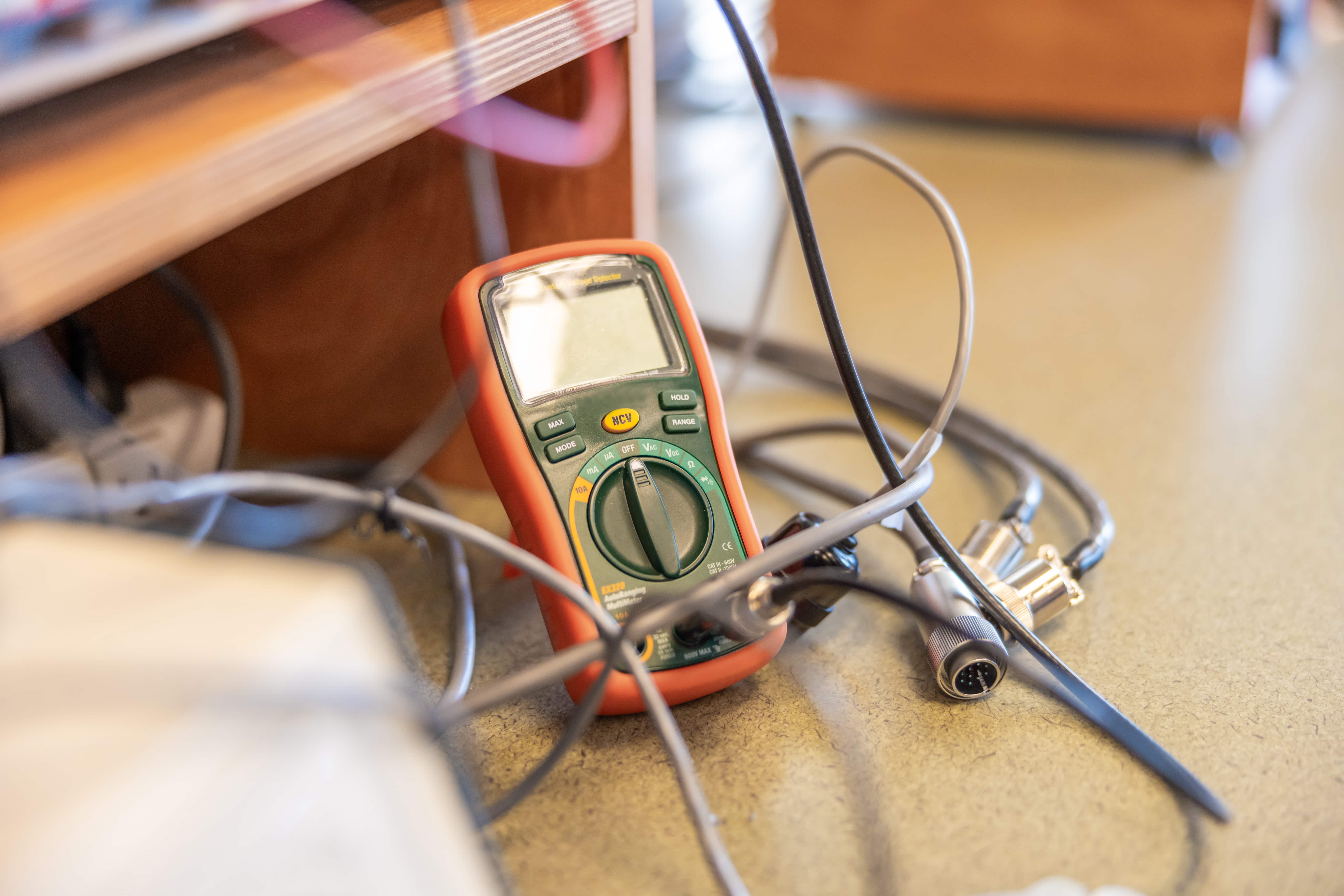 a digital multimeter with wires