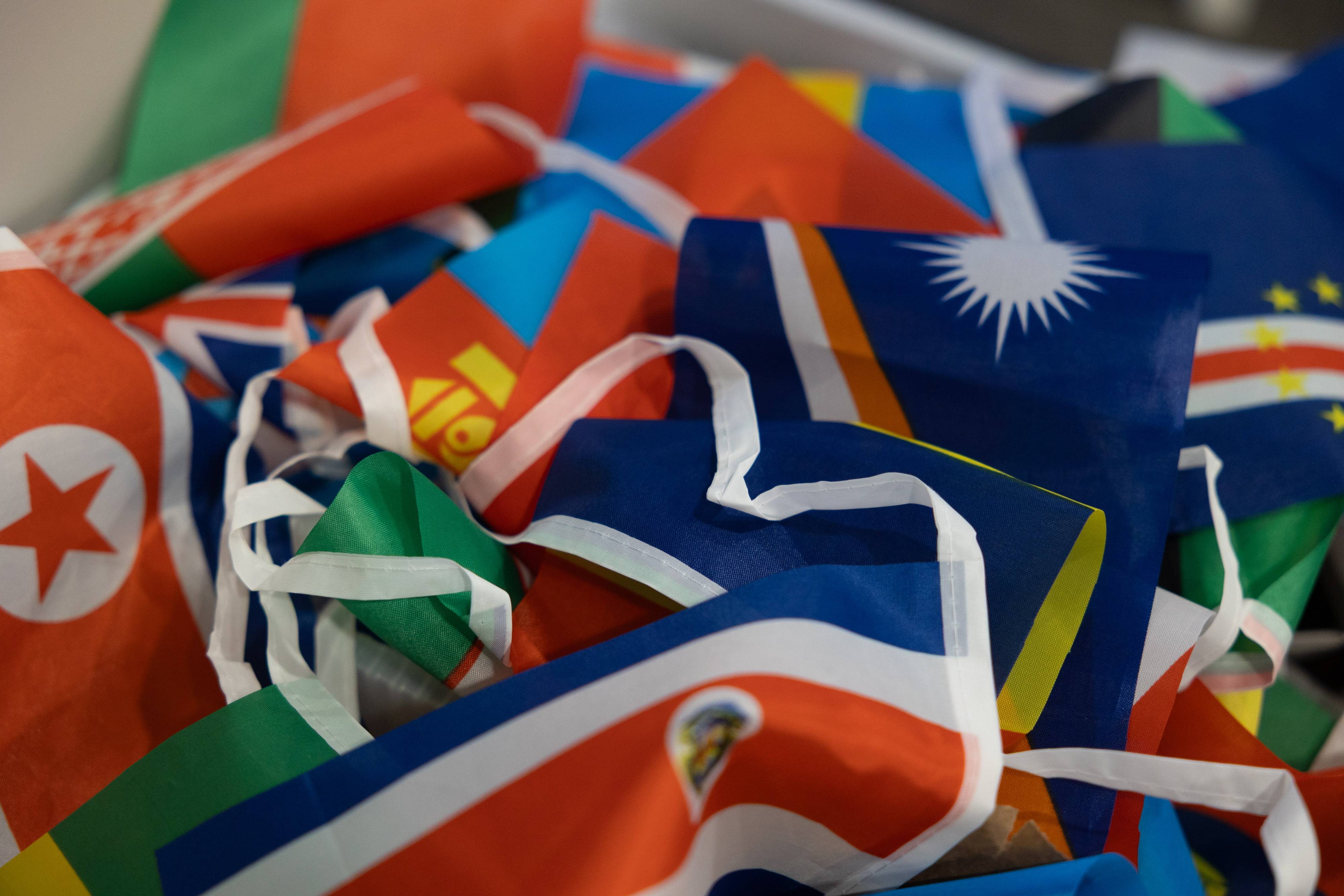 a pile of colorful flags
