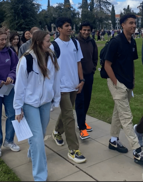 Students walk across campus as part of a peace walk