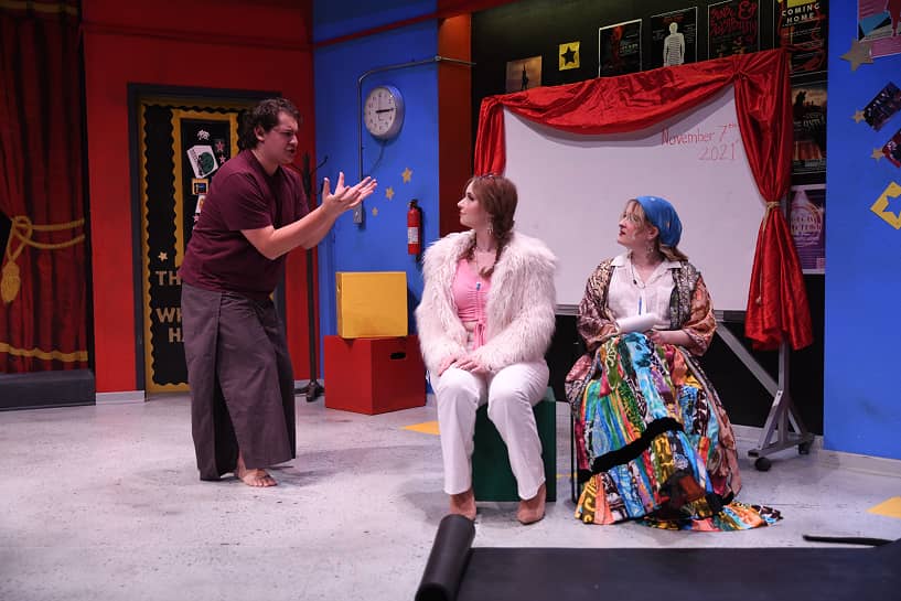 a person talking to a group of women