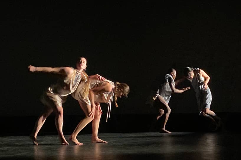 a group of people dancing on a stage