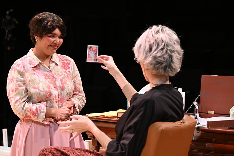a person holding a photo of a child
