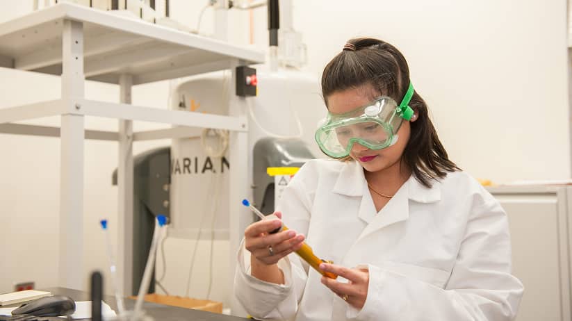 a person wearing goggles and holding a device