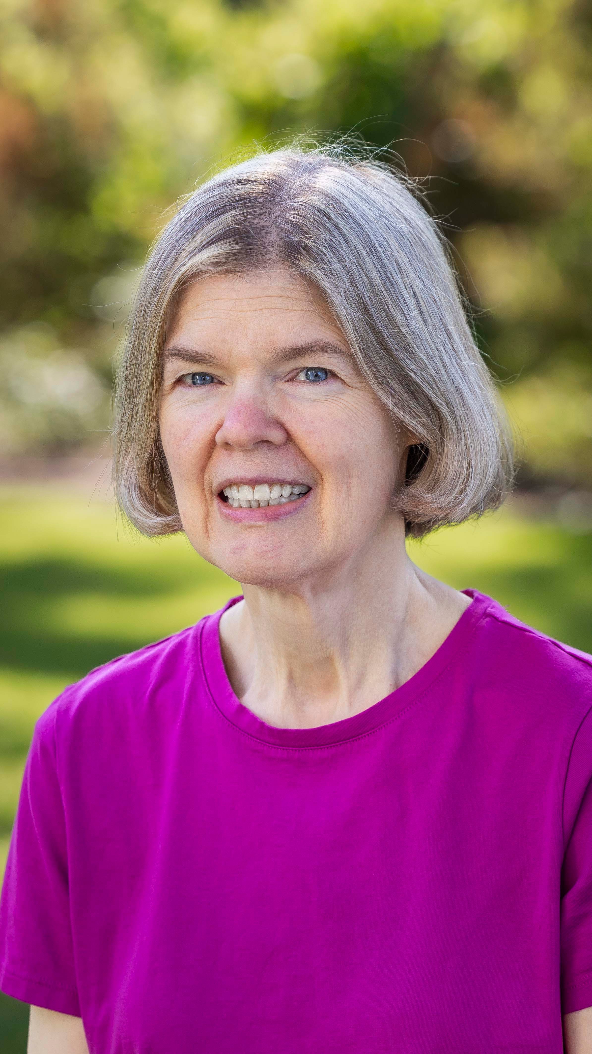 a woman in a purple shirt