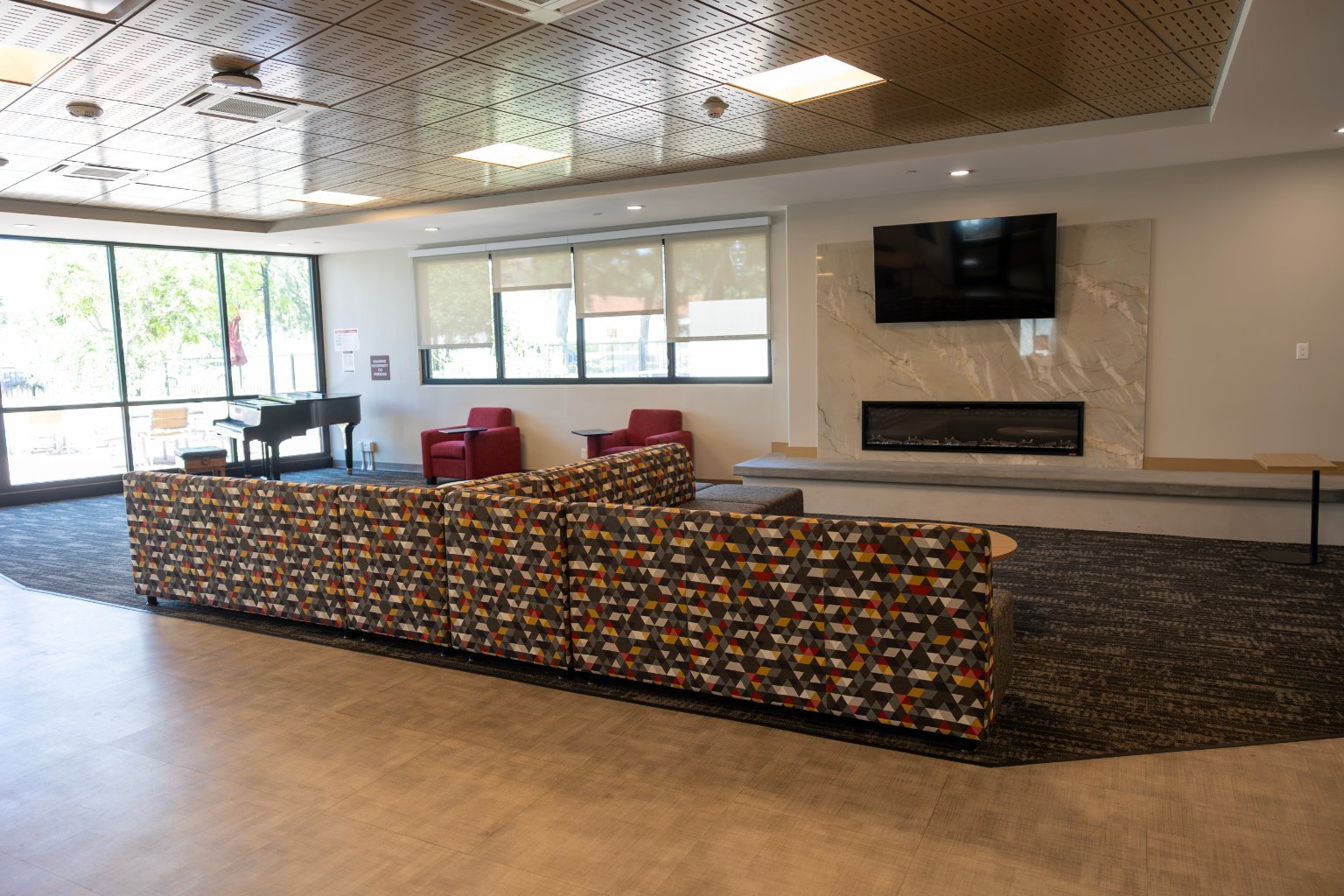 a room with a couch and a fireplace