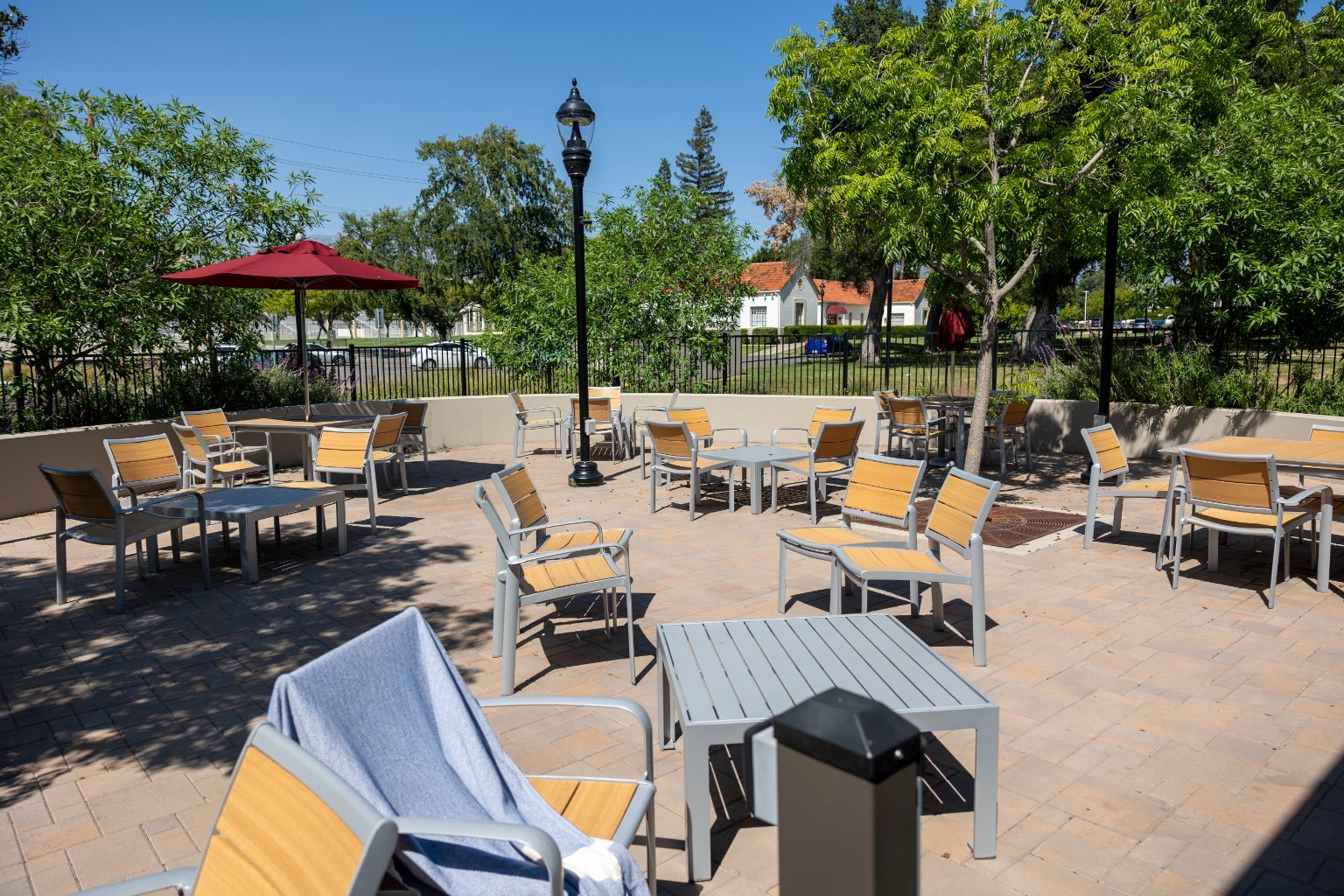 a patio with chairs and tables