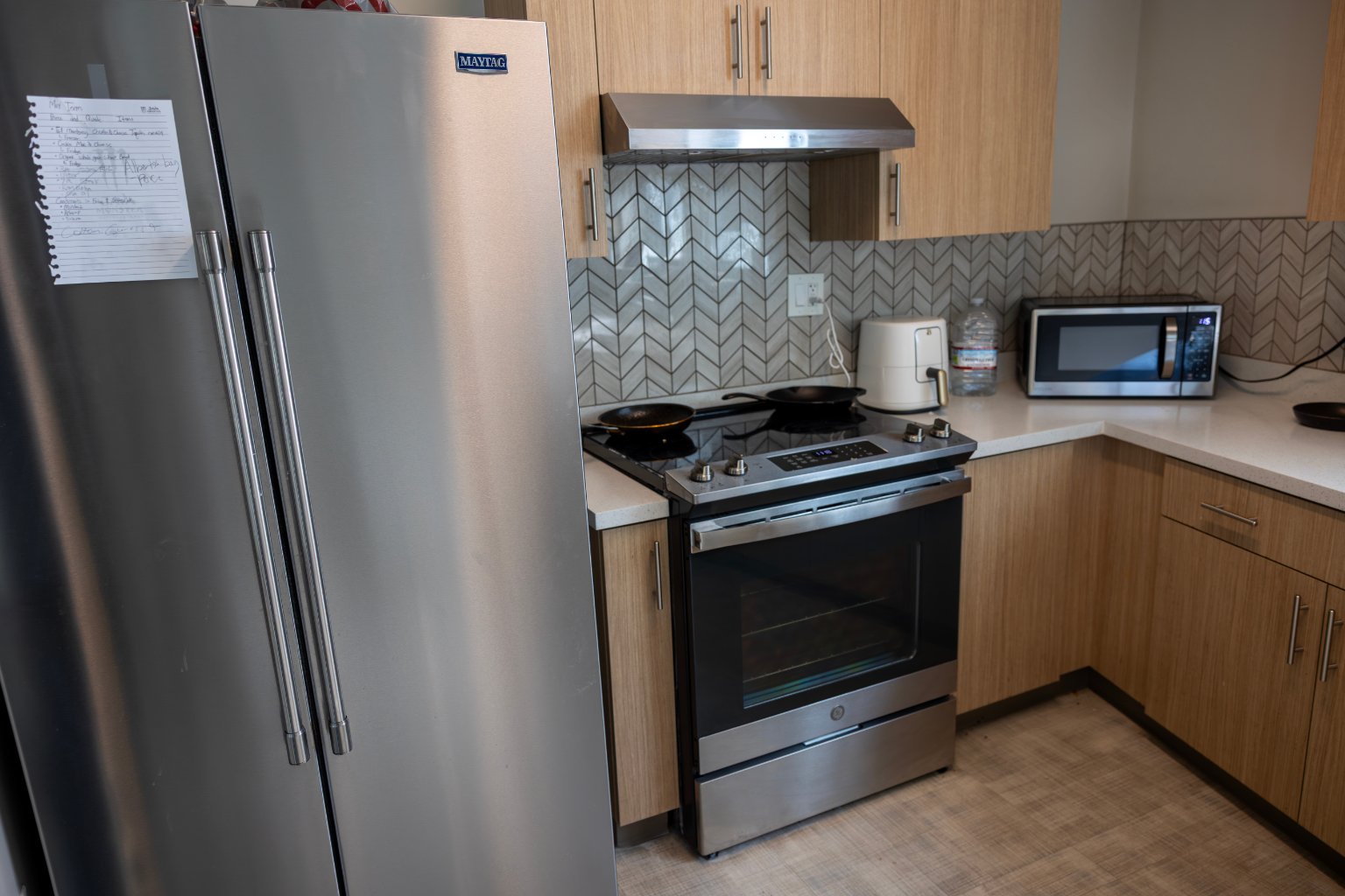 a kitchen with a stove and a refrigerator