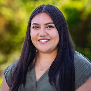 a woman with long hair smiling