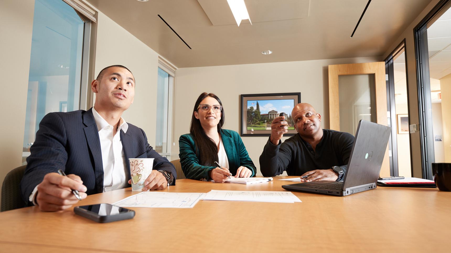 a group of people sitting at a table