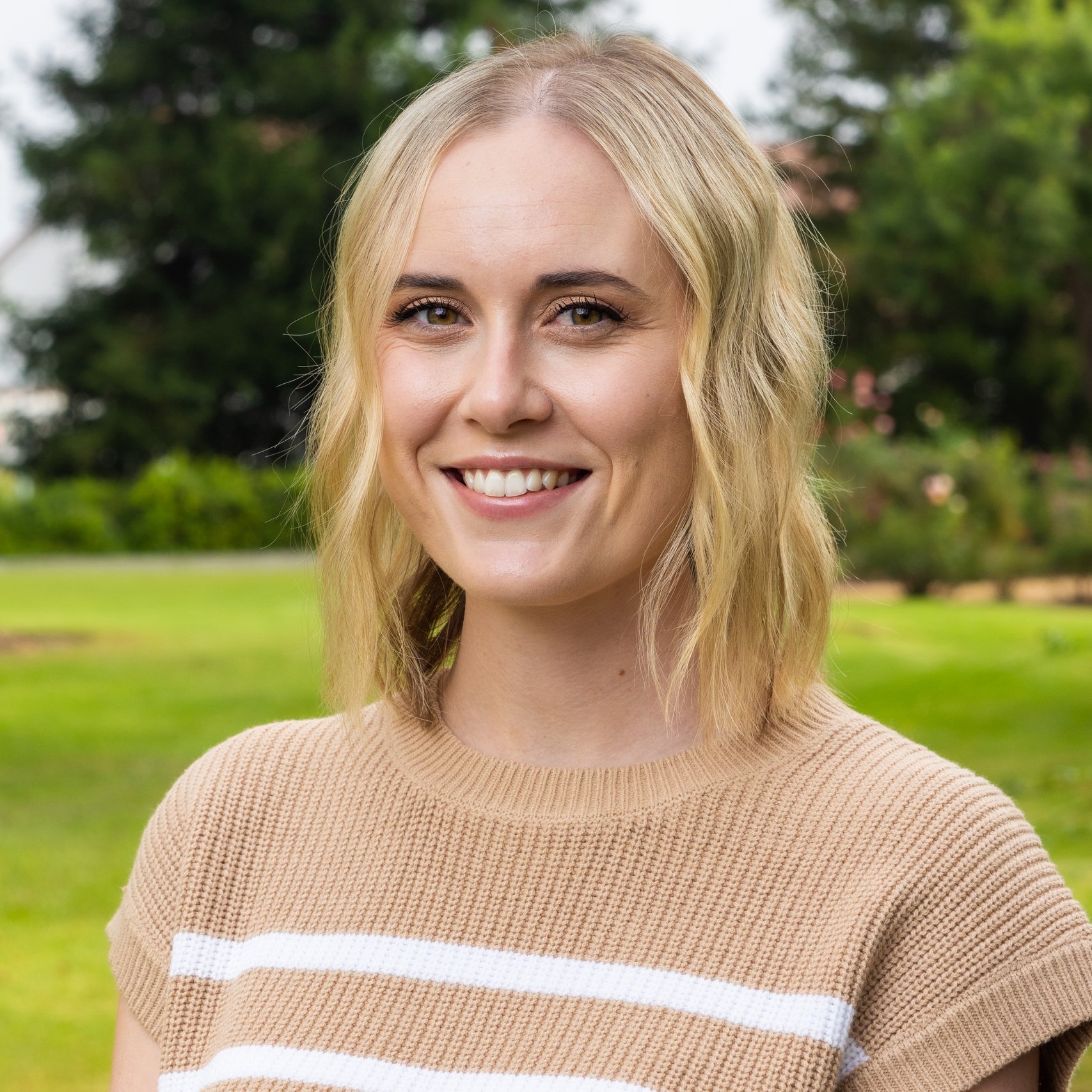 a woman smiling at camera