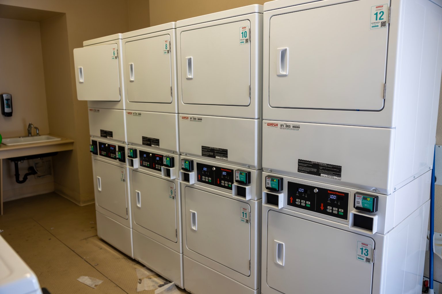 a group of white laundry machines