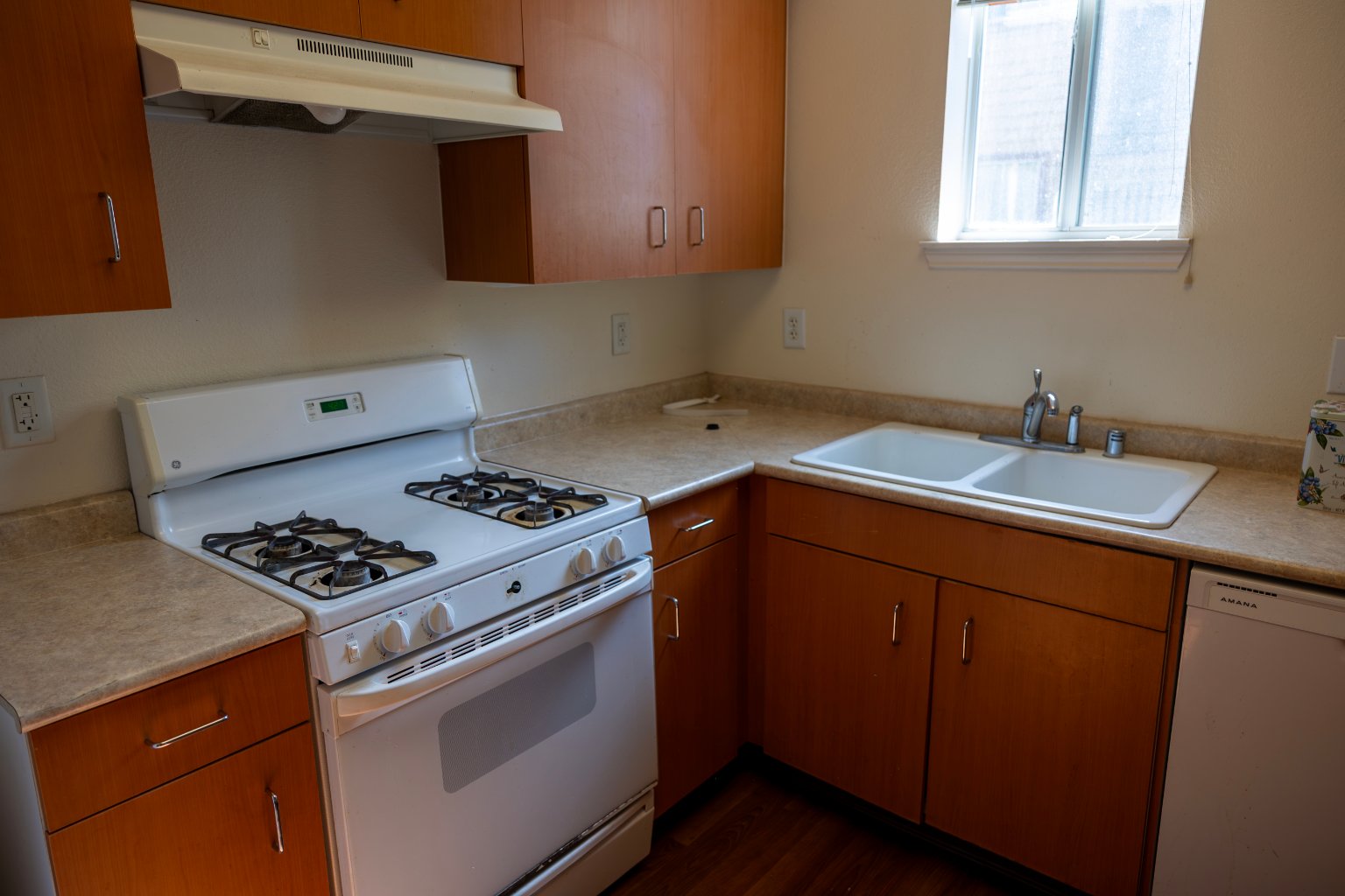 a kitchen with a stove and sink