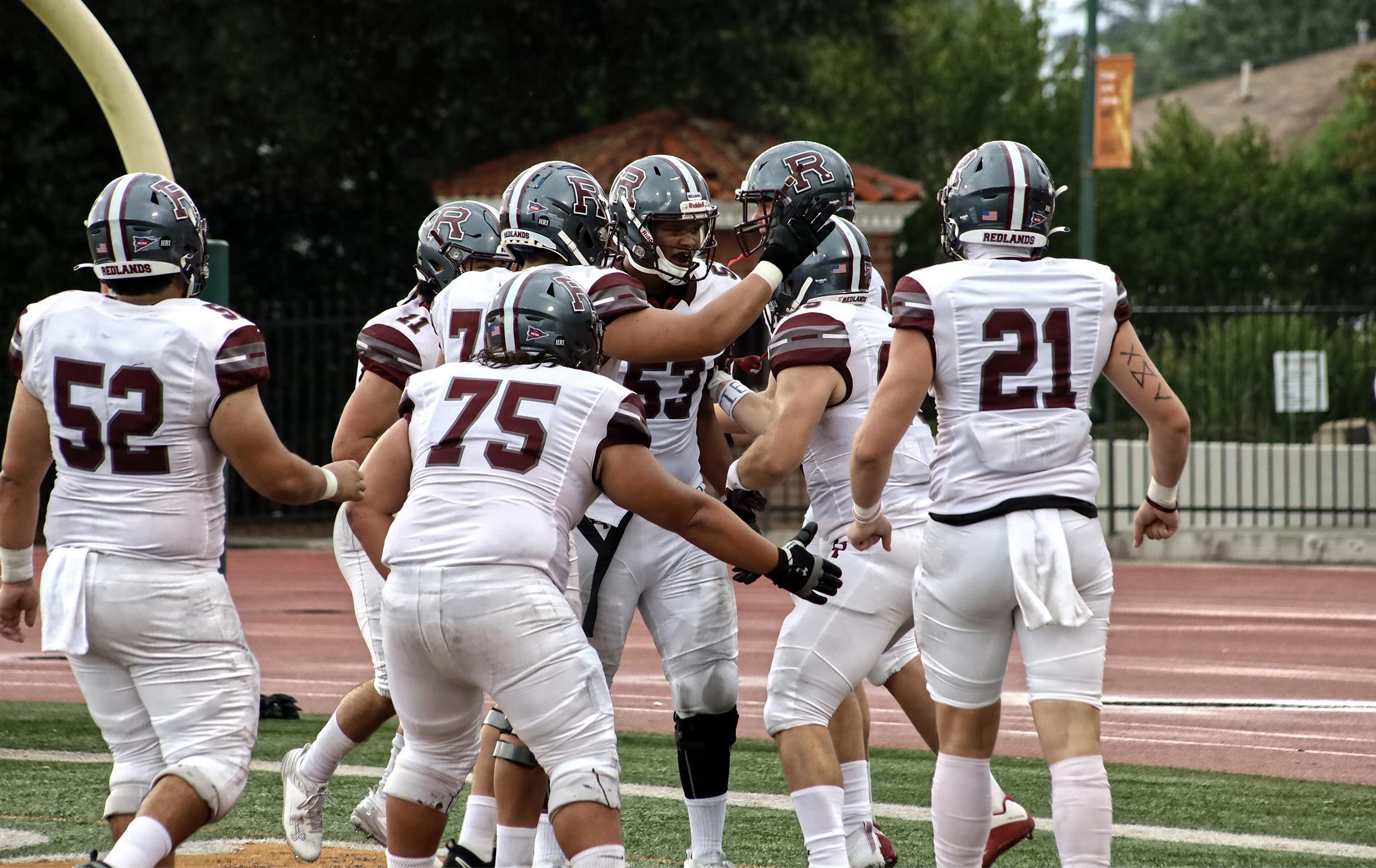 a group of football players on a field