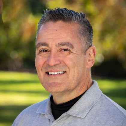 a man smiling at the camera