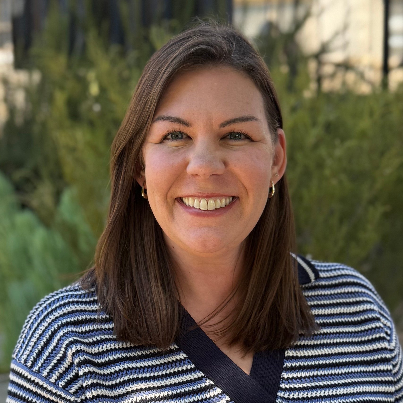 a woman smiling for a picture
