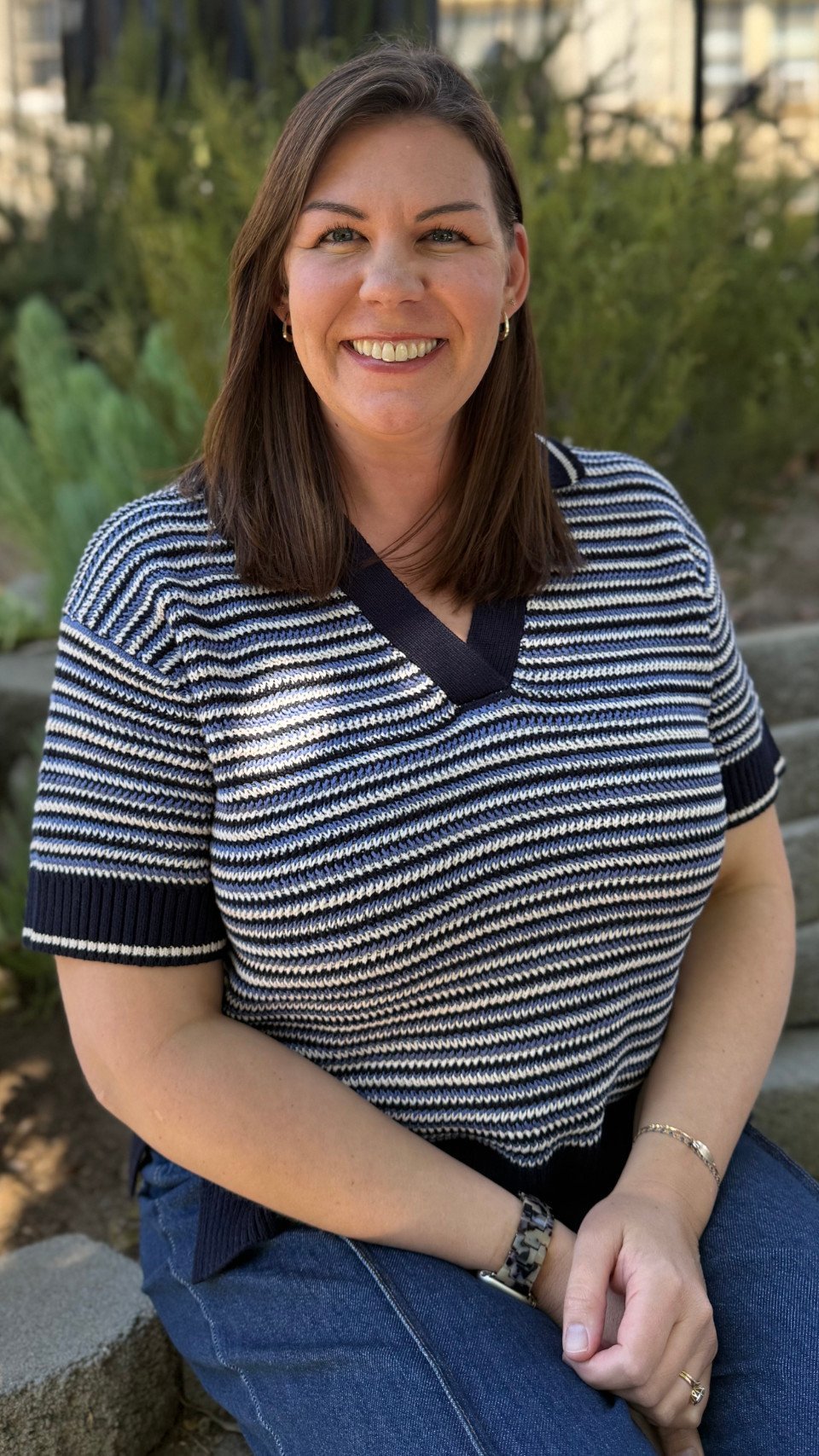 a woman smiling at camera
