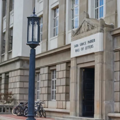 a lamp post in front of a building