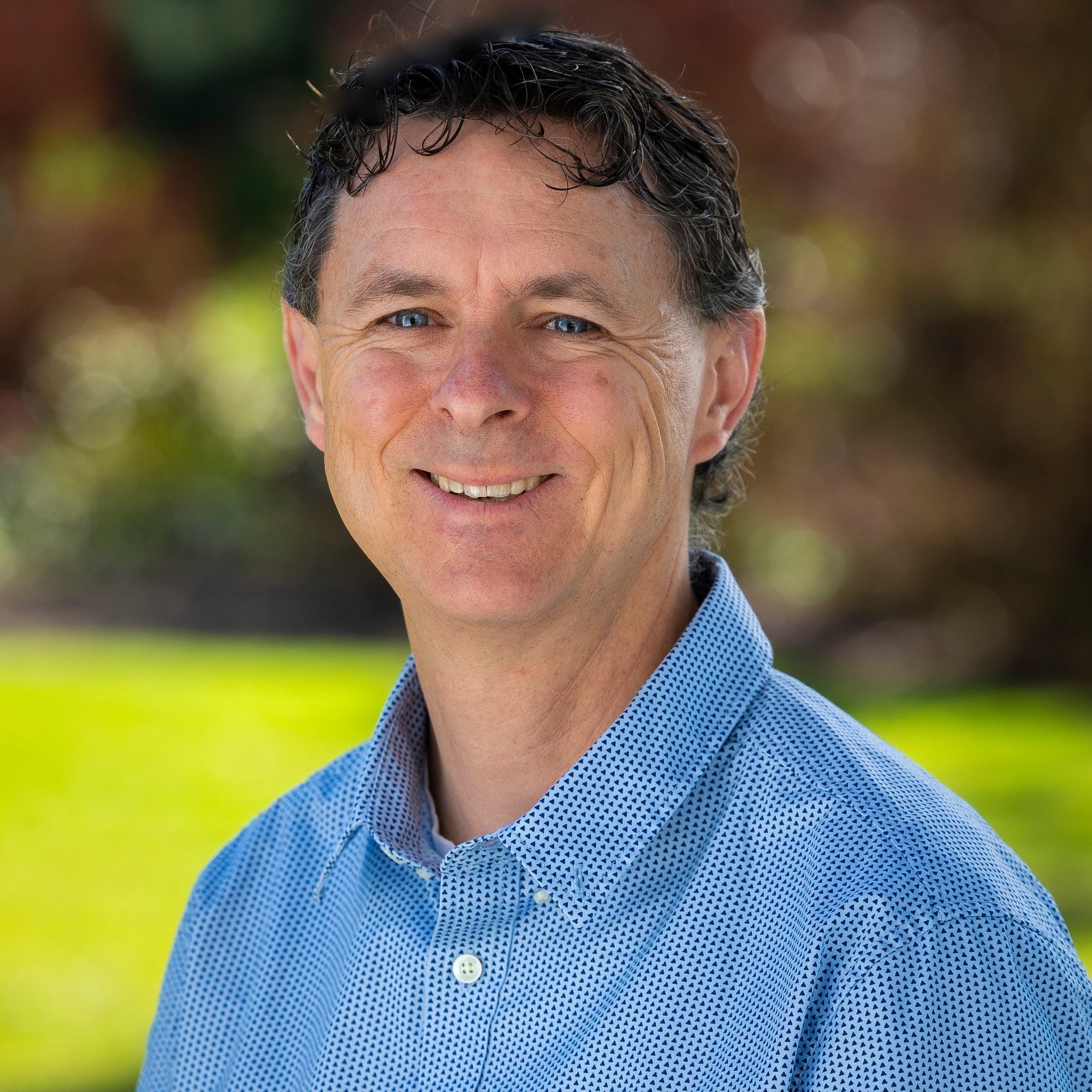 a man smiling for a picture