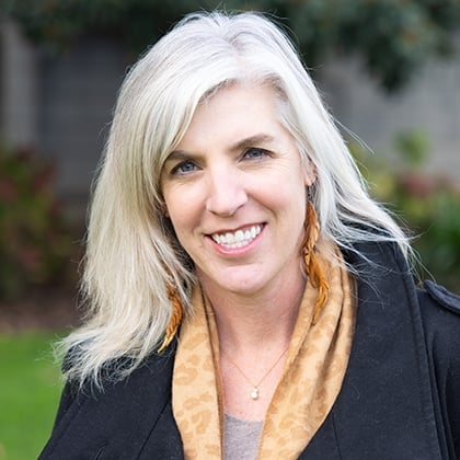 a woman smiling at the camera