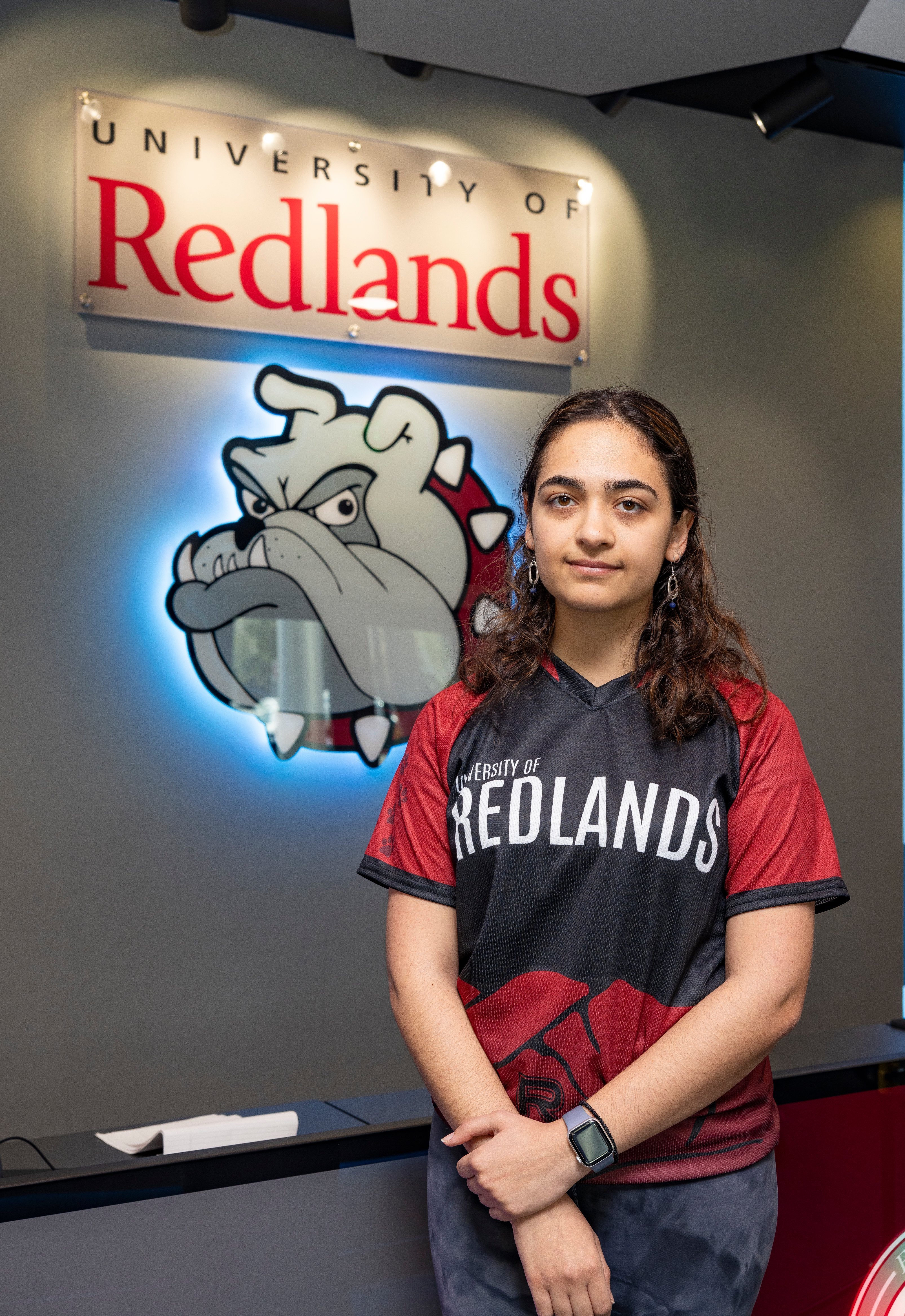 a woman standing in front of a sign