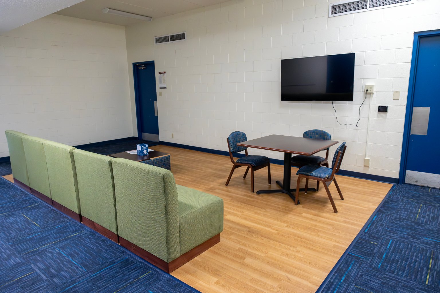 a room with a table and chairs