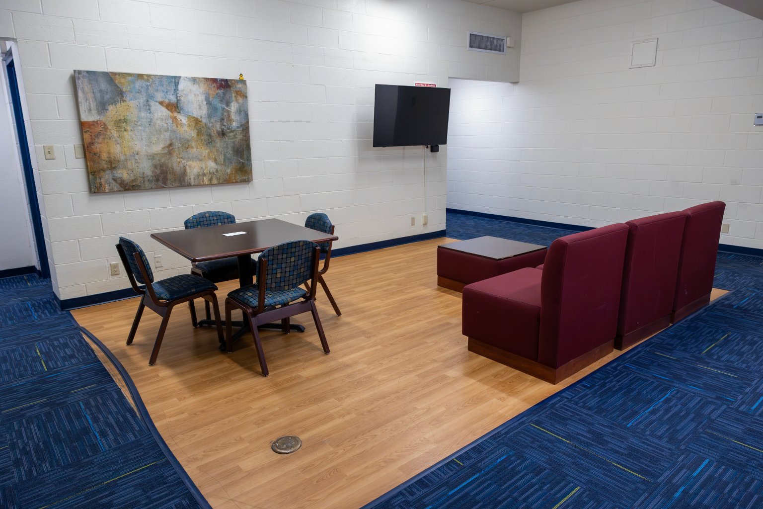 a room with a table and chairs