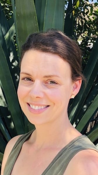 a woman smiling at the camera