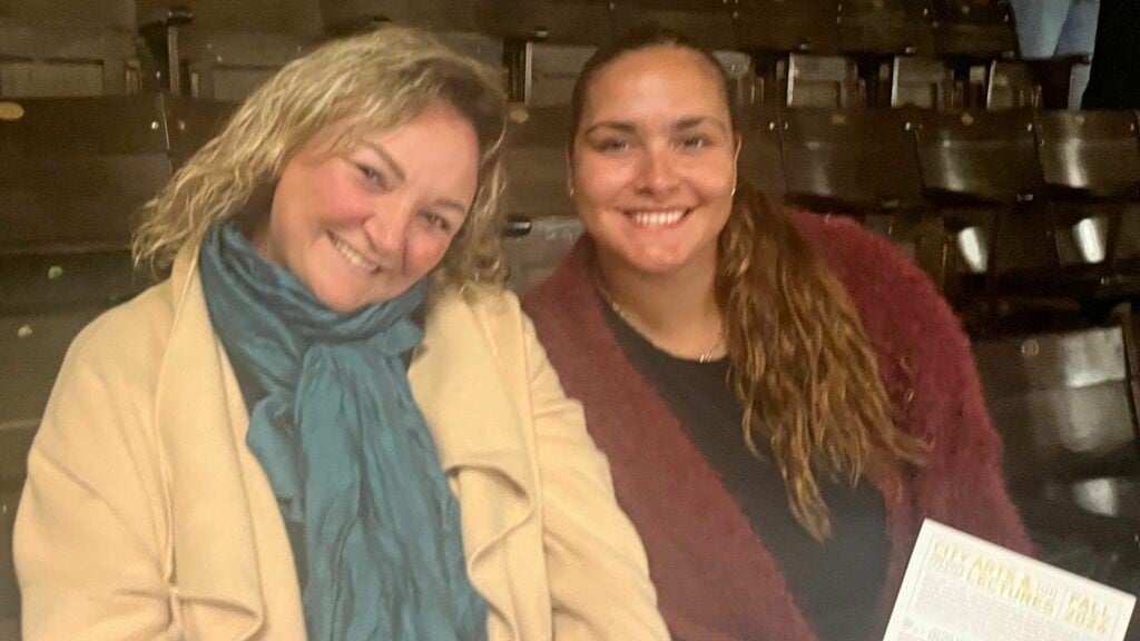 two women smiling at the camera