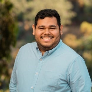 a man smiling at the camera