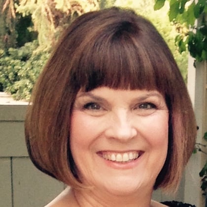 a woman smiling at the camera