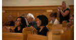 a group of people sitting in a church