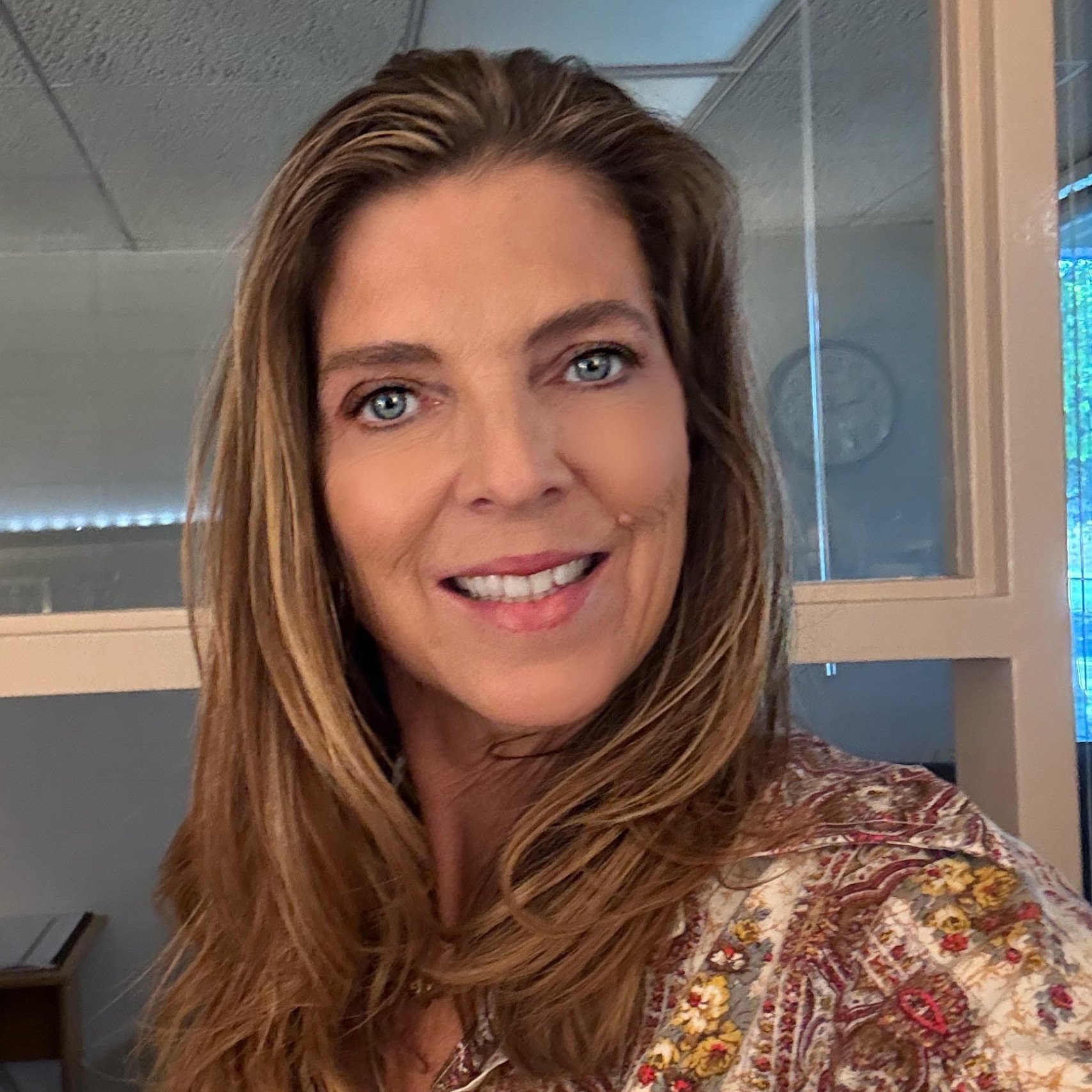 a woman smiling at the camera