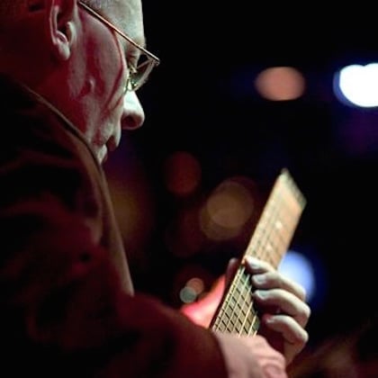 a man playing a guitar