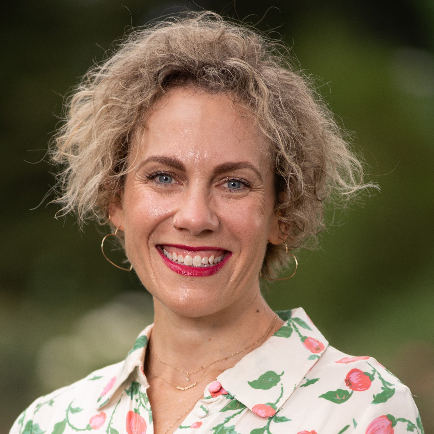 a woman smiling for a picture