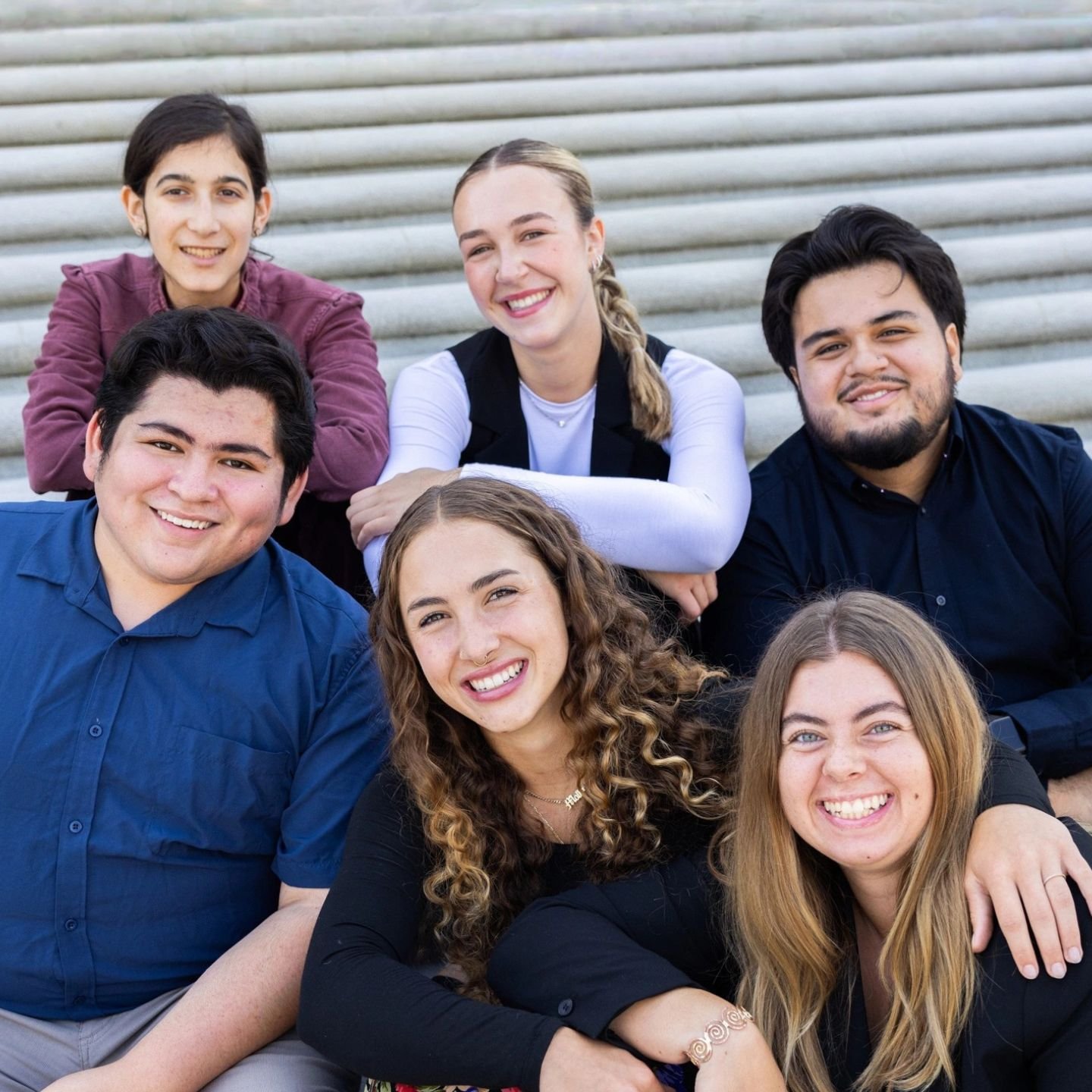 a group of people posing for a photo