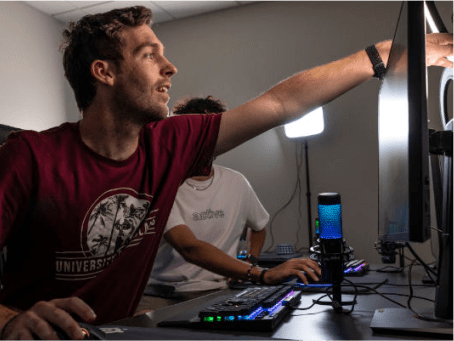 a man pointing at a computer screen