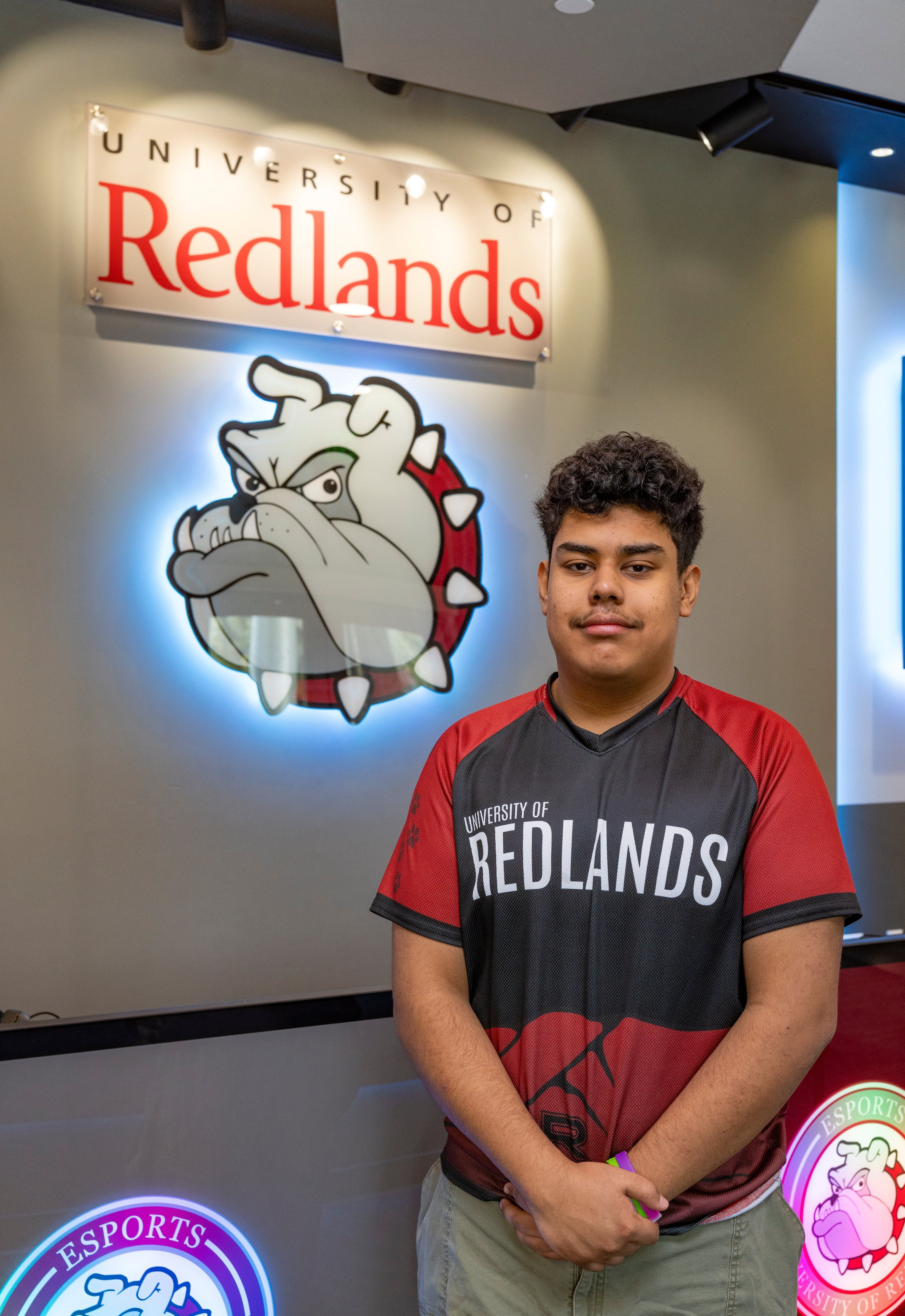 a man standing in front of a sign