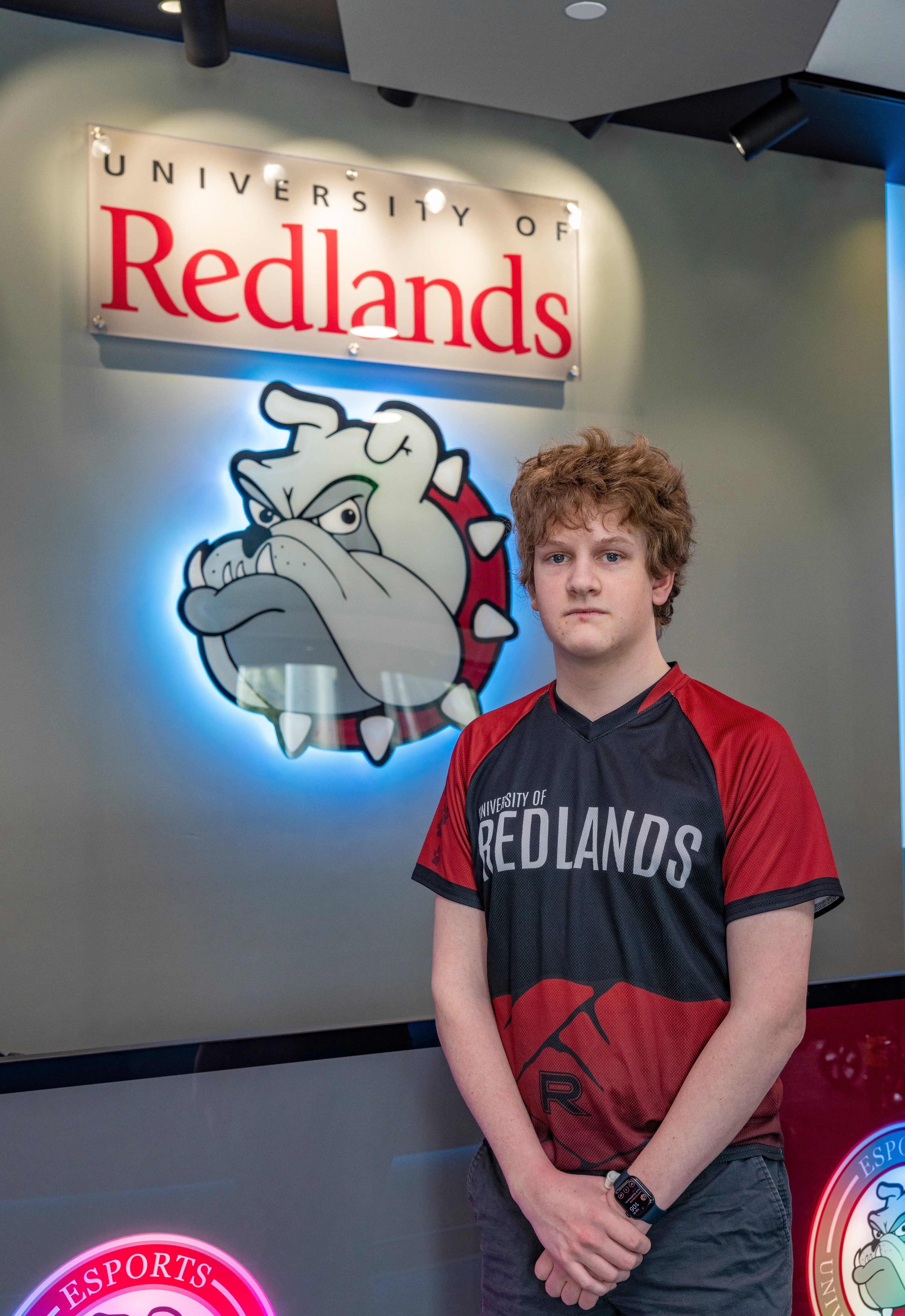 a man standing in front of a sign