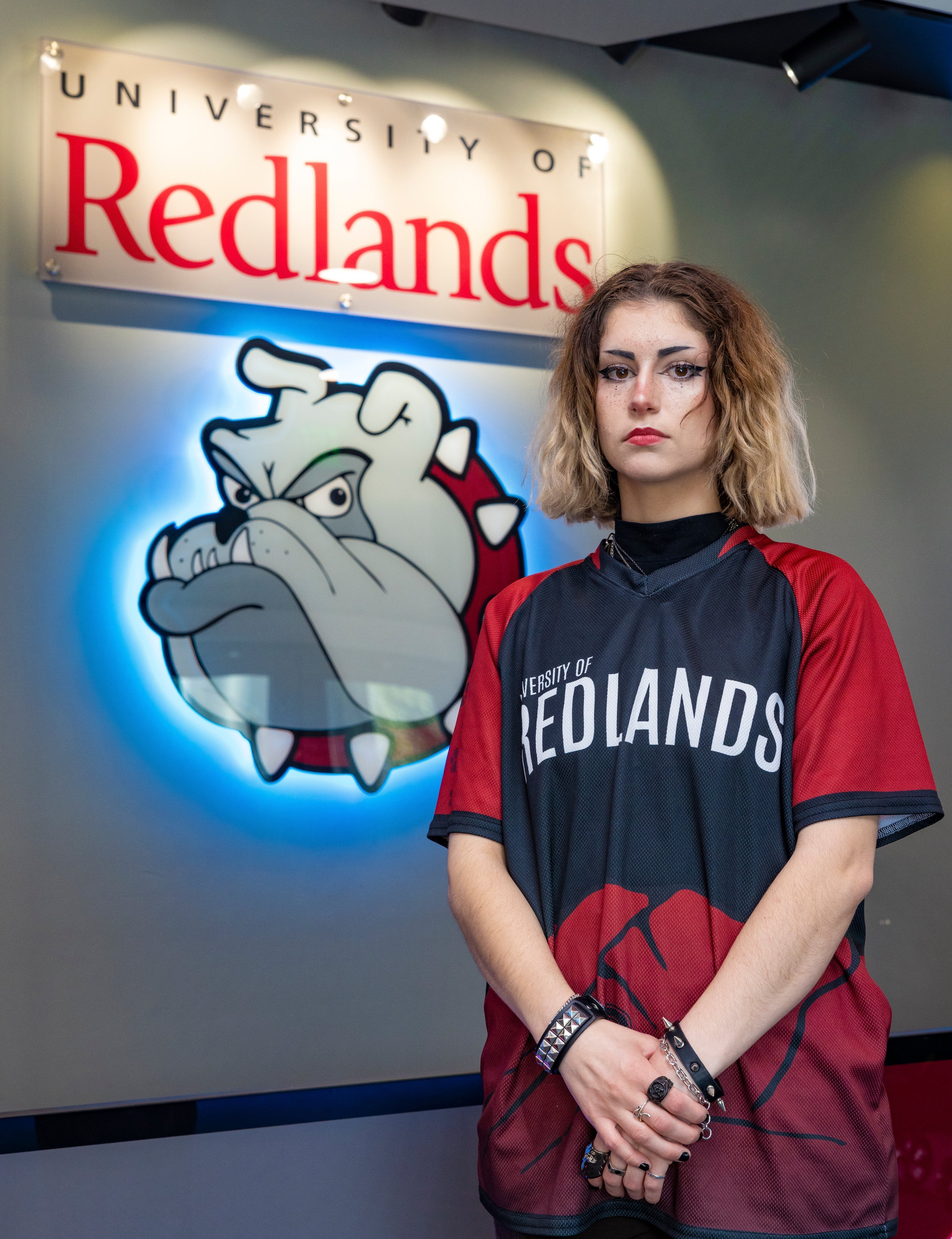 a woman standing in front of a sign