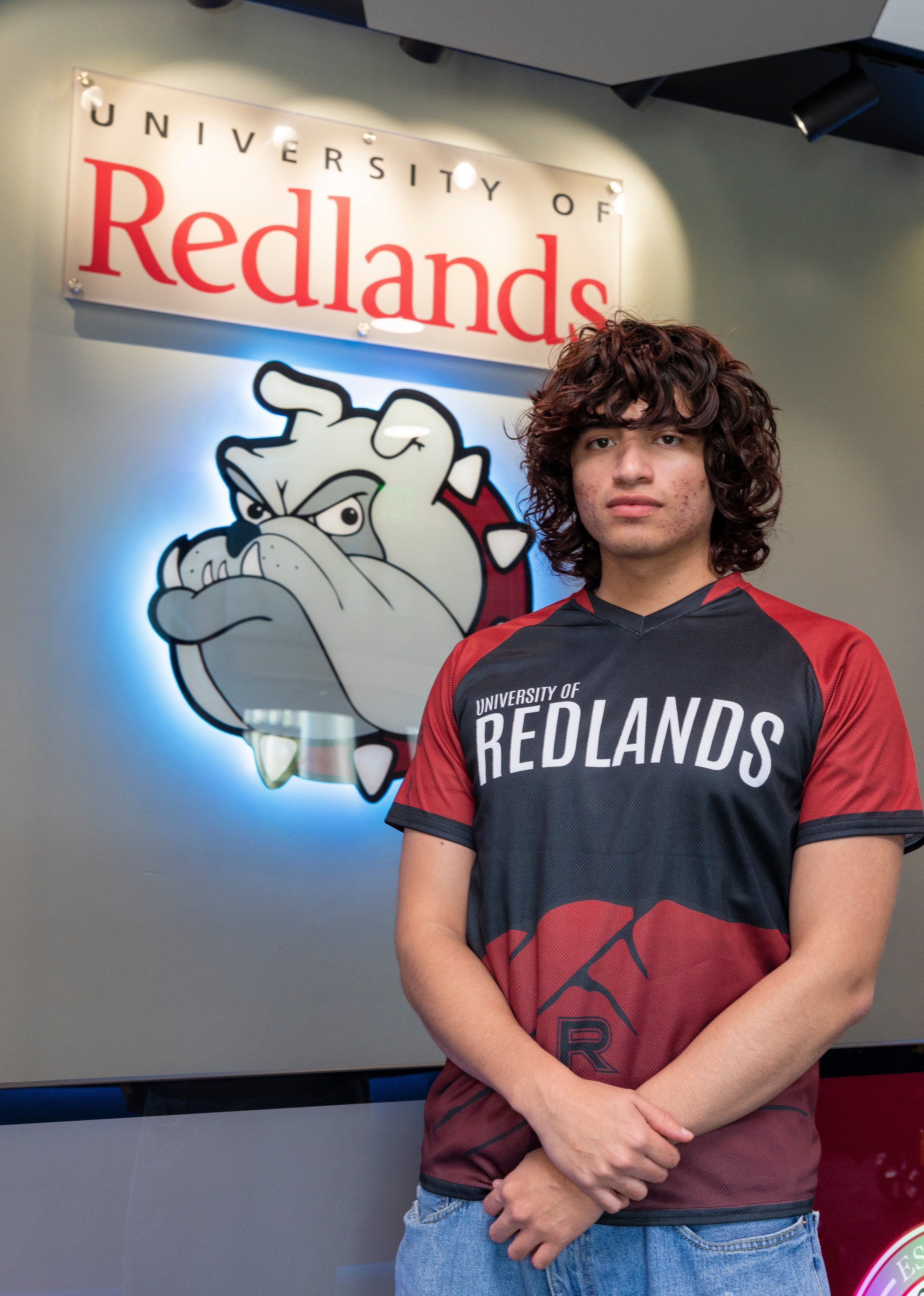 a man standing in front of a sign