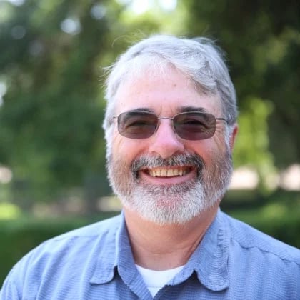 a man with a beard and sunglasses