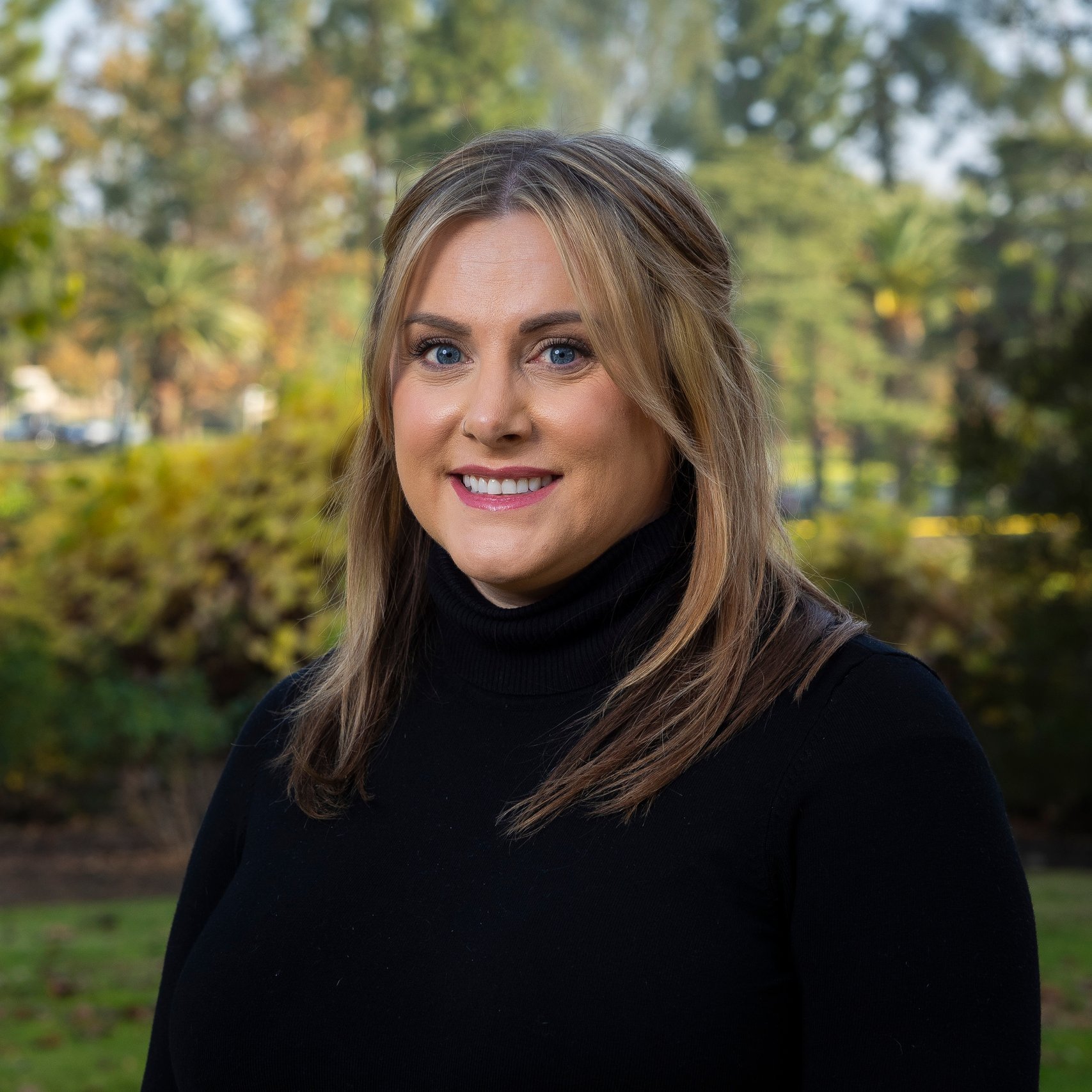 a woman smiling at camera