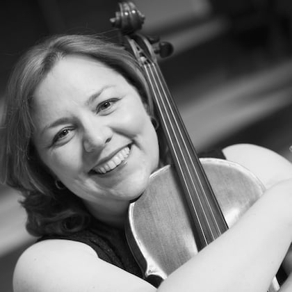 a woman holding a violin