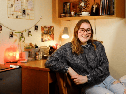 a woman sitting on a desk