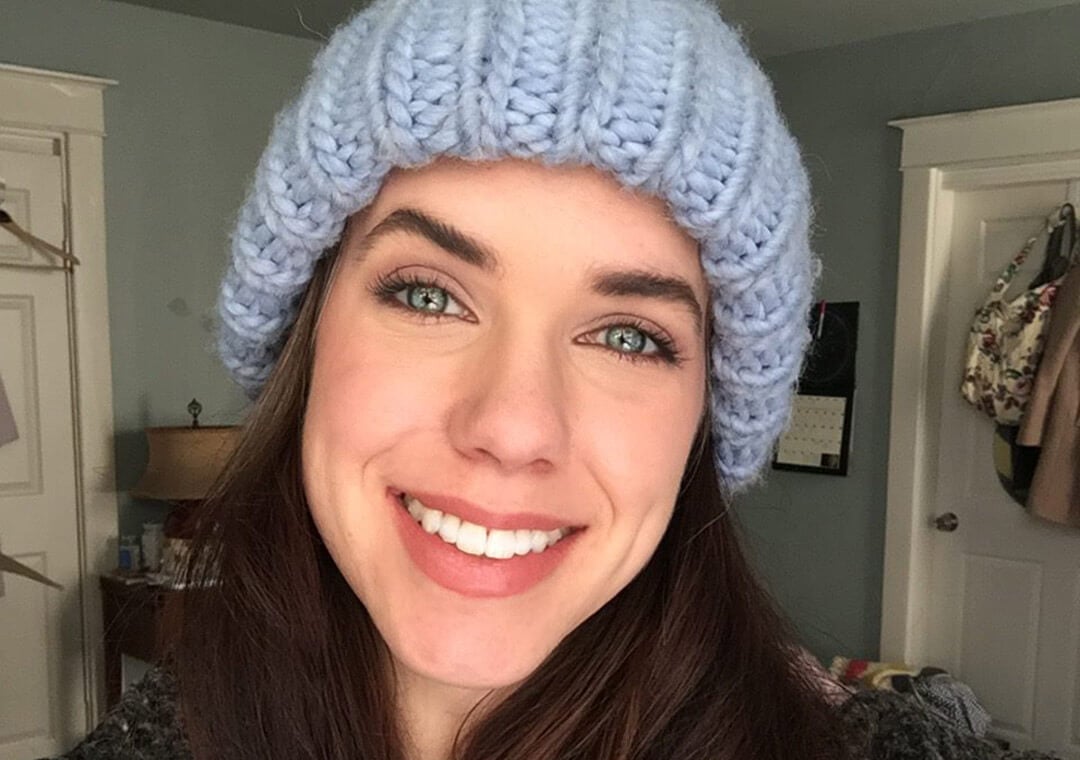 a woman wearing a knit hat