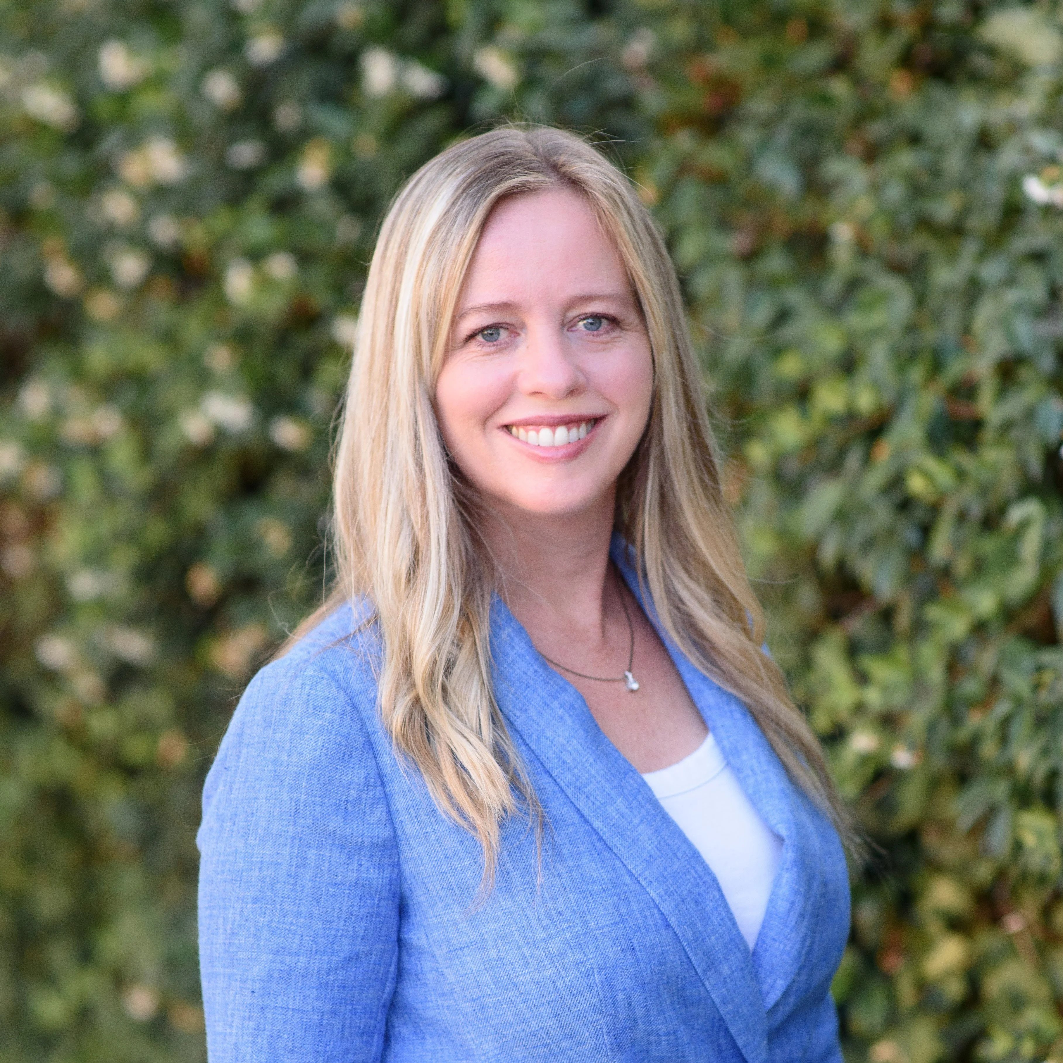 a woman smiling at camera