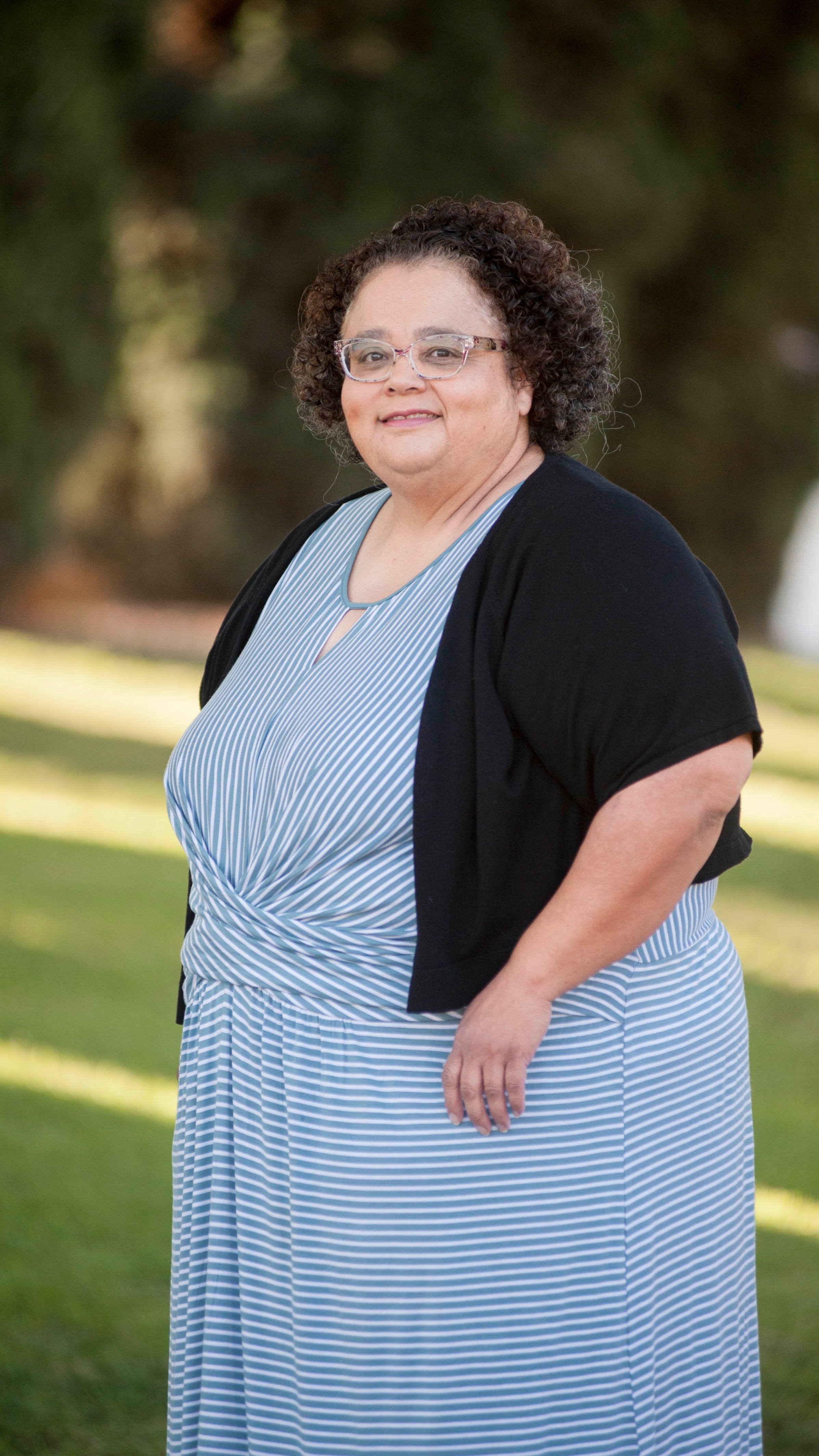 a woman in a striped dress